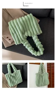 Detail view of the mint green plush tote bag featuring unique vertical tubular pleats