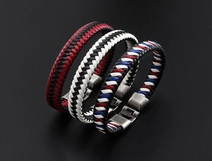 Close-up of multicolored braided leather bracelets with vintage silver alloy clasps