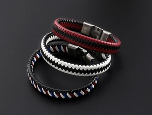 Close-up of woven leather bracelets in multiple colors with vintage alloy buckles