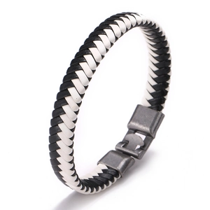 Braided leather bracelet with black and white weave and dark grey metallic clasp