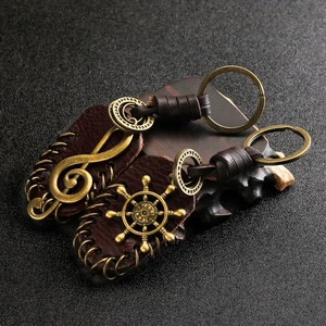 Vintage leather keychain set with antique bronze music note and ship wheel pendants