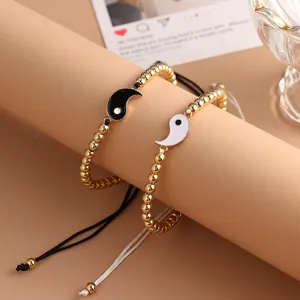 Adjustable Yin Yang braided bracelets for couples with gold beads and enamel pendants