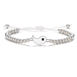 Detailed view of woven Tai Chi bracelet with white yin yang charm and silver beads