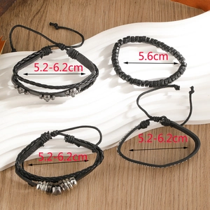 Detailed view of woven leather bracelets with skull charm and wood beads, size measurements shown