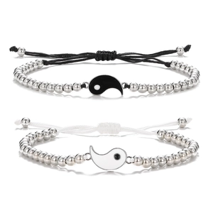 Tai Chi Yin Yang braided bracelets set for couples featuring polished metal beads