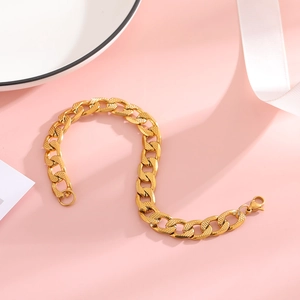 Textured gold Cuban link bracelet with embossed details and secure lobster clasp closure