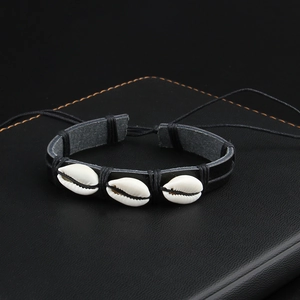 Handmade woven leather bracelet with natural shells and adjustable cord for men and women