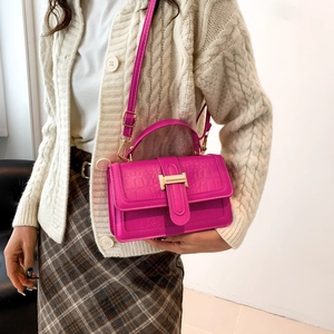 Women's fuchsia crocodile pattern leather handbag with gold H buckle and shoulder strap