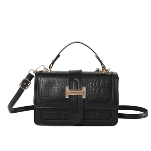 Elegant black crocodile pattern crossbody bag with golden metal buckle for women