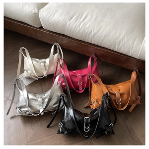 Detailed display of vintage motorcycle style handbags in five vibrant glossy colors