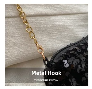 Detail of sequin shoulder bag featuring premium gold metal chain and lobster clasp