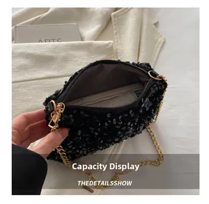 Capacity showcase of the black sequin crossbody bag with gold chain and soft lining