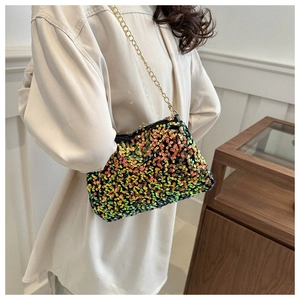 Detailed close-up of a colorful sequin crossbody bag with a golden metal chain strap