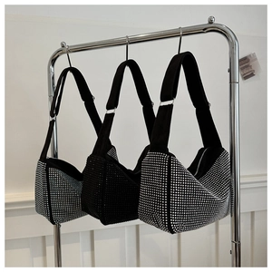 Detailed row of glittering rhinestone hobo bags in black and silver on hangers