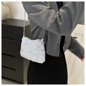 Detail shot of white iridescent sequin chain bag with fish scale texture and gold strap