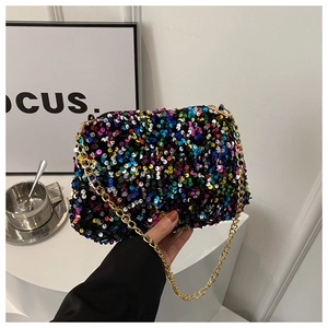 Detail of colorful sequins and gold chain strap on the stylish women's crossbody bag
