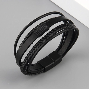 Close-up of black multilayer braided leather bracelet with matte magnetic metal clasp