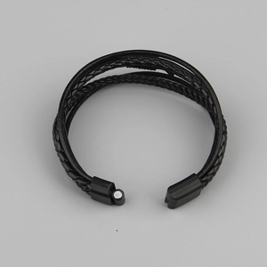 Men's multi-layer braided leather bracelet with black magnetic clasp in a minimalist style
