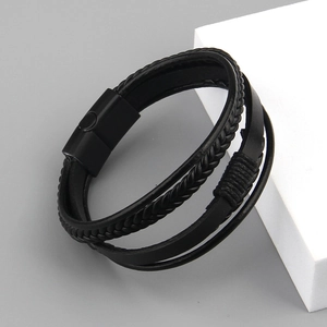 Detailed view of multilayer black braided leather bracelet with matte magnetic clasp