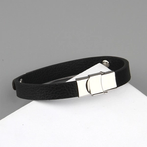 Men's minimalist black leather skull bracelet with polished silver steel magnetic clasp