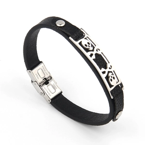 Men's punk leather bracelet featuring stainless steel skull charms and secure clasp