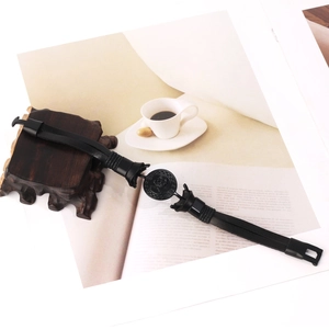 Retro punk black leather bracelet for men featuring a skull emblem on a coffee table