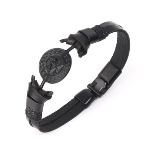 Retro punk black leather bracelet for men featuring a skull emblem and woven edges