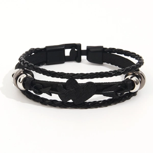 Retro multi-layer woven leather bracelet featuring a silver heart and arrow metal charm