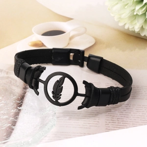 Retro punk black woven leather bracelet featuring a silver-tone metal feather charm