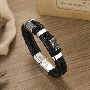 Men's retro braided black leather bracelet with silver Celtic knot charms and magnetic clasp