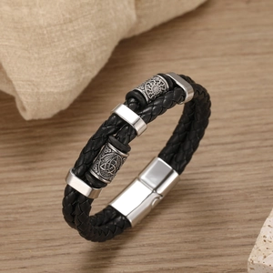 Close-up of double-layer braided leather bracelet with engraved silver metal magnetic clasp