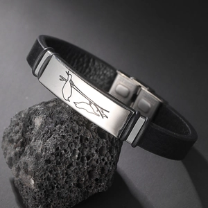 Men's minimalist black leather bracelet with engraved bird pattern on steel plate