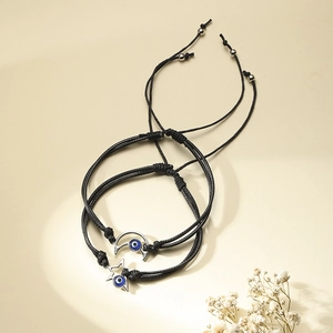 Adjustable black wax cord bracelets with silver star moon charms and blue evil eye beads