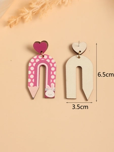 Detail shot of wood pencil rainbow earrings with size labels 6.5cm and 3.5cm