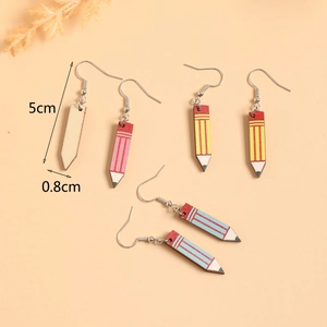 Detail view of colorful wooden pencil earrings with size measurements of 5cm by 0.8cm
