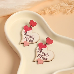 Mother's Day heart-shaped wooden drop earrings with Thanks Mom print on a silk background