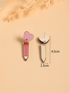 Detail showing dimensions of wooden pencil and heart earrings on a cream background