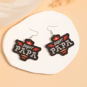 Detail of Western style wood earrings with Super Papa print and crown motif