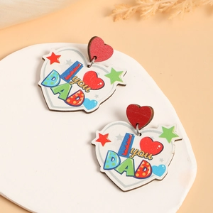 Detailed view of heart-shaped wooden earrings featuring I Love You Dad printed text