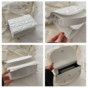 Detail view of white quilted crossbody bag showing magnetic closure and interior space