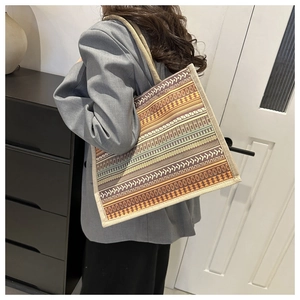 Detail of bohemian geometric pattern on linen tote bag with rope handles and large capacity
