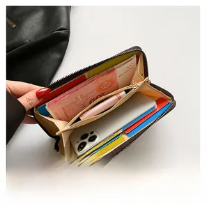 Detail view of deep coffee long wallet showing large capacity for phone and cards