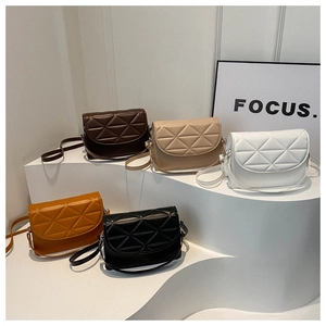 Detailed display of vintage quilted crossbody bags in five colors on a tiered stand
