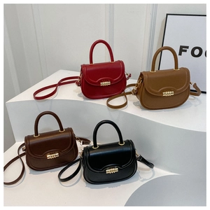 Detail showing high-quality synthetic leather saddle bags in four colors with gold metal locks