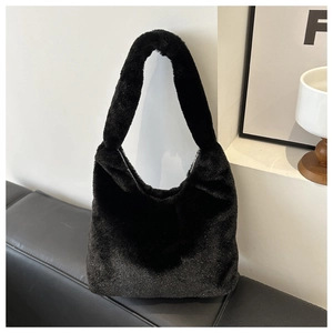 Detail shot of the black faux fur hobo bag showing its sparkling glitter star-like texture