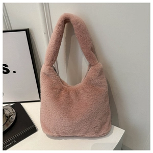 Detailed macro shot of pink faux fur texture and metal zipper on this large tote bag