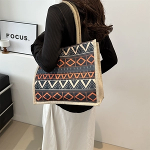 Vintage geometric print tote bag with orange and navy ethnic patterns for daily use