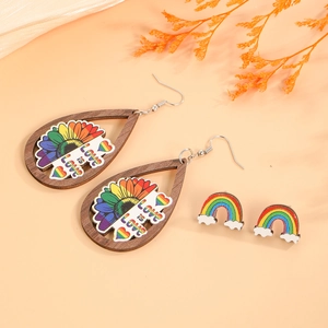 Rainbow sunflower wooden earrings with Love is Love print and colorful cloud studs