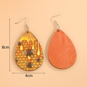 Bohemian teardrop wooden earrings with honeybee and honeycomb print patterns