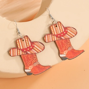 Detail view of Western cowboy boot and hat drop earrings with ethnic geometric patterns